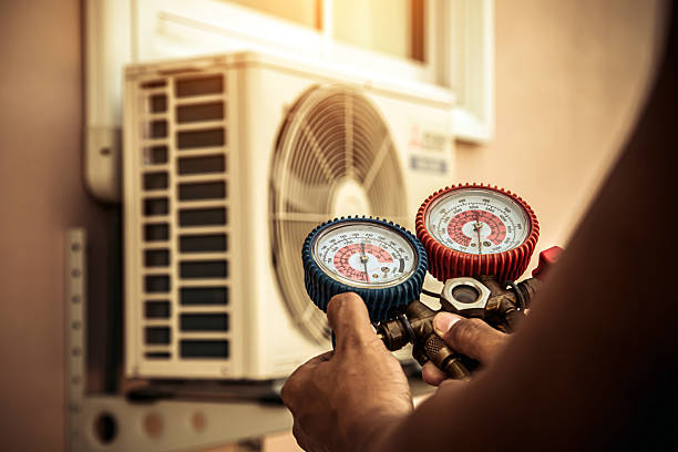 Professional Heat Pump Repair technician working in Prides Crossing, MA
